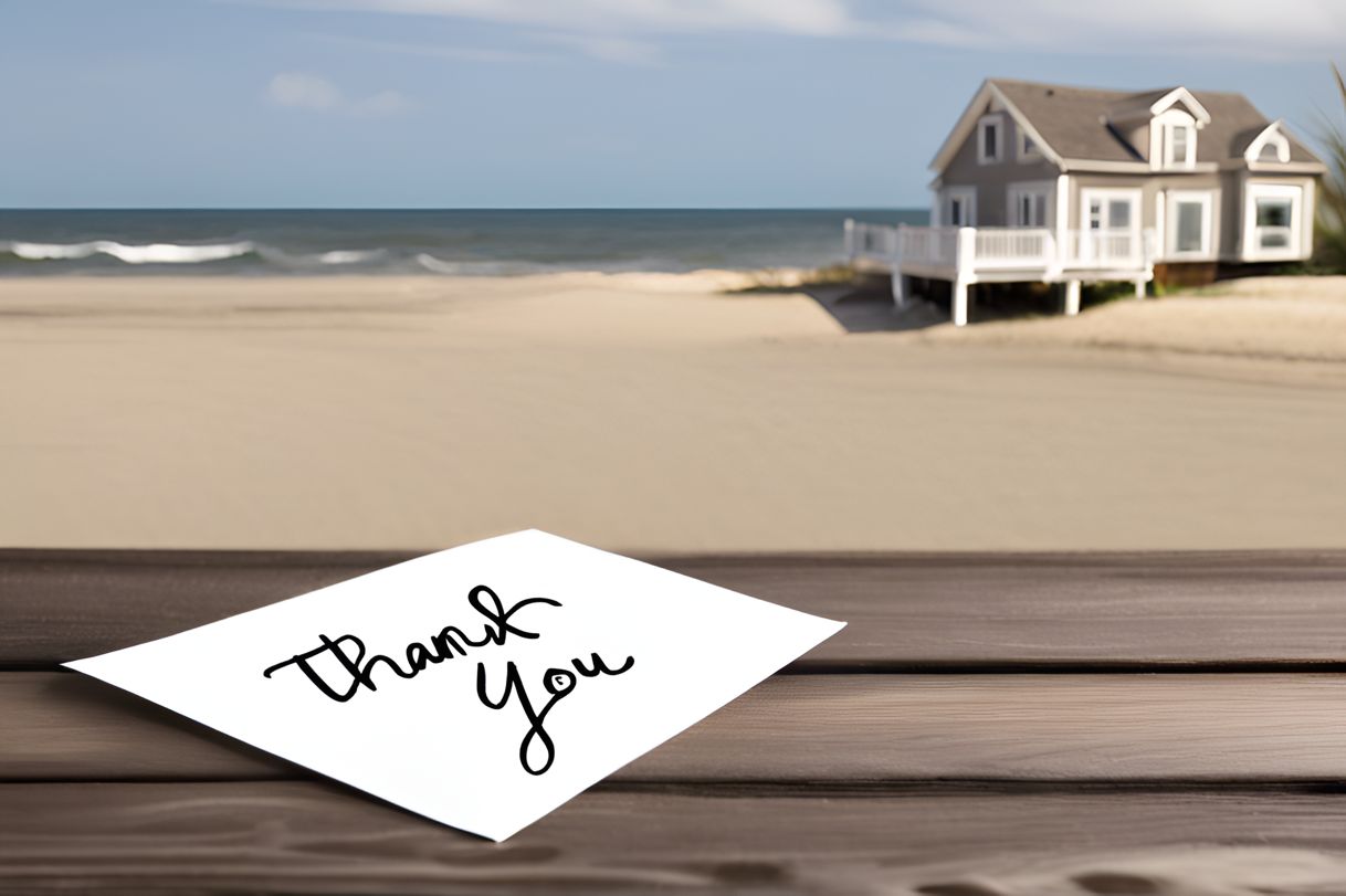 Handwritten thank you note with beach house in the background